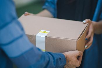 a man holding a box in his hands